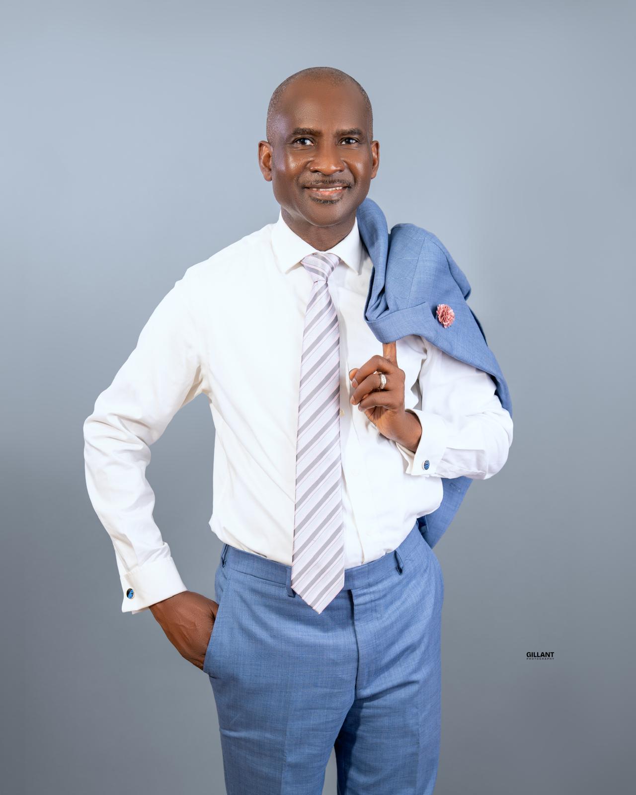 Mutiu Babatunde in a blue suit
